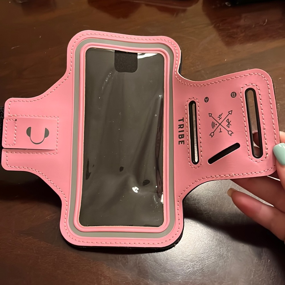 Light pink workout phone arm band.